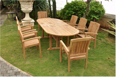 Wooden outdoor dining set with table and chairs on a grassy area
