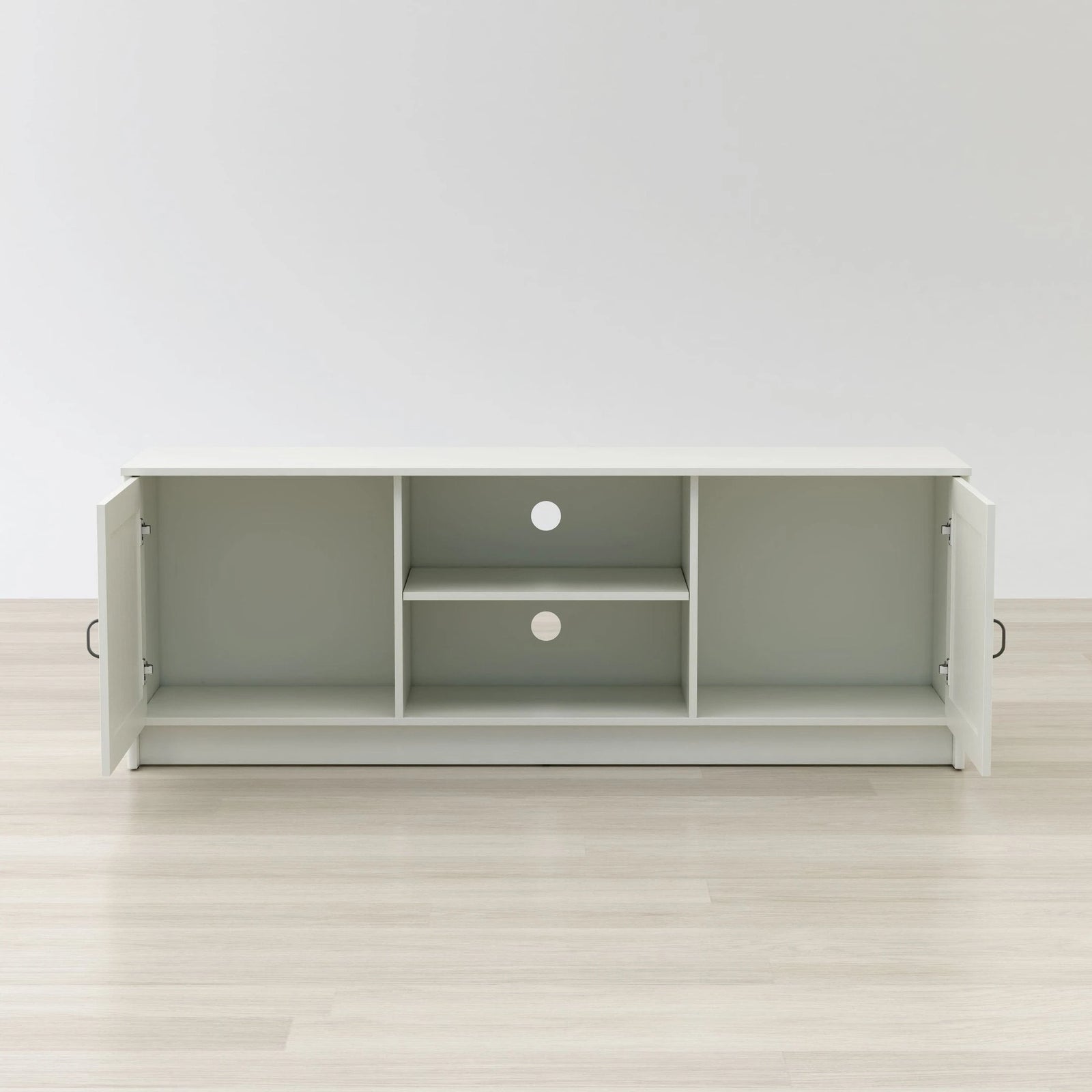 Gray entertainment console with open doors on a light wood floor and white wall background