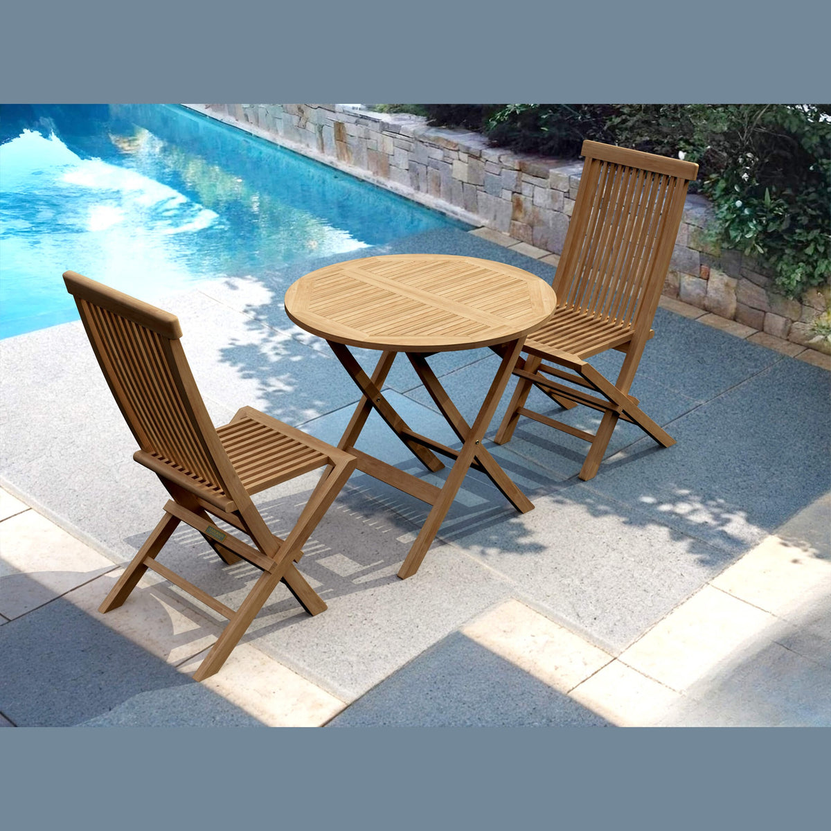 Wooden outdoor table and chairs by a pool