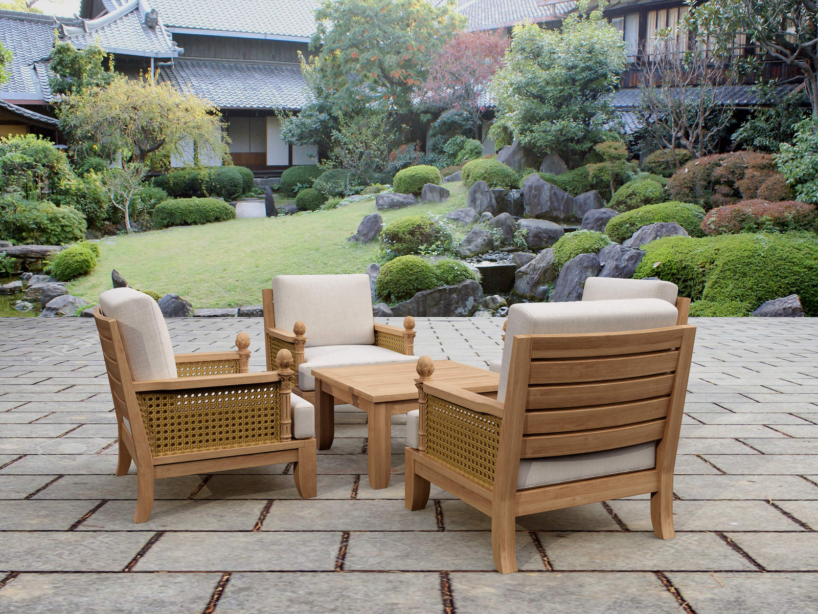 Outdoor furniture set with wooden chairs and table on a stone patio, garden in the background