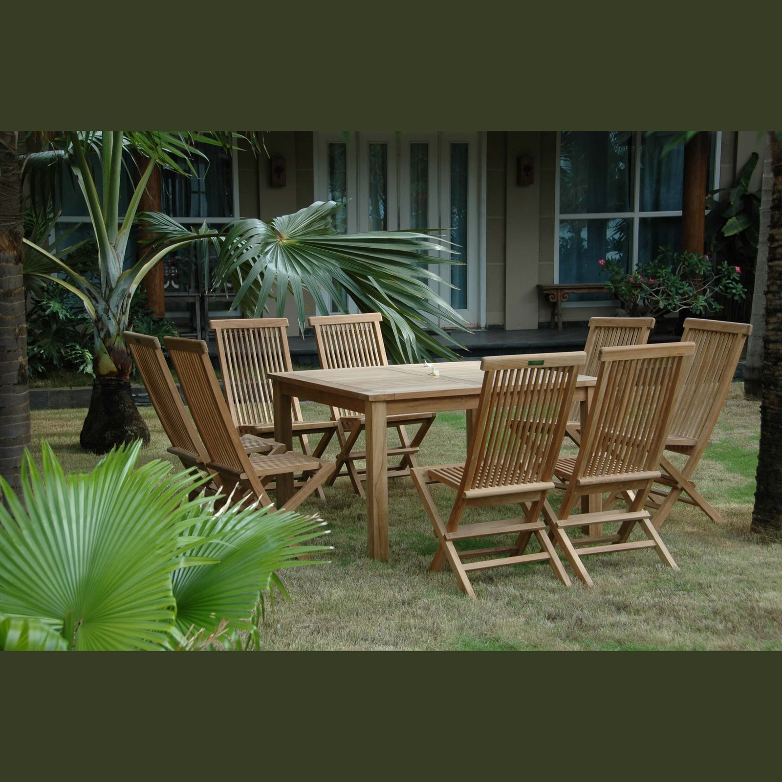 Wooden outdoor dining set with chairs and table in a garden setting