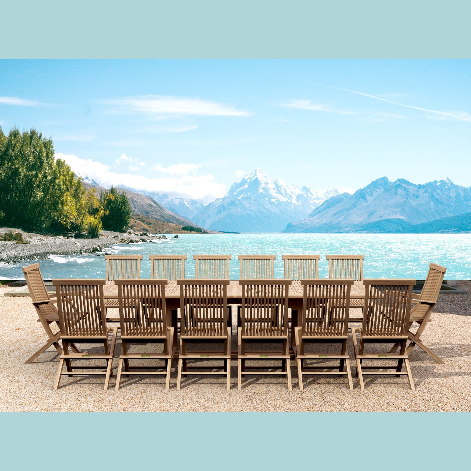 Wooden outdoor dining set with chairs by a lake and mountains
