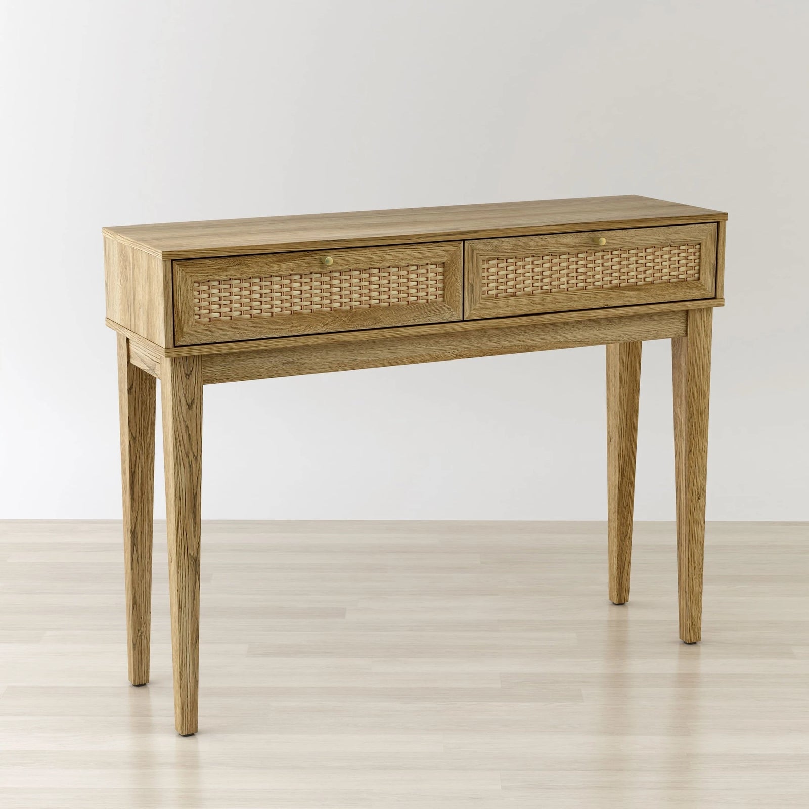 Wooden console table with rattan drawers on a light wooden floor.