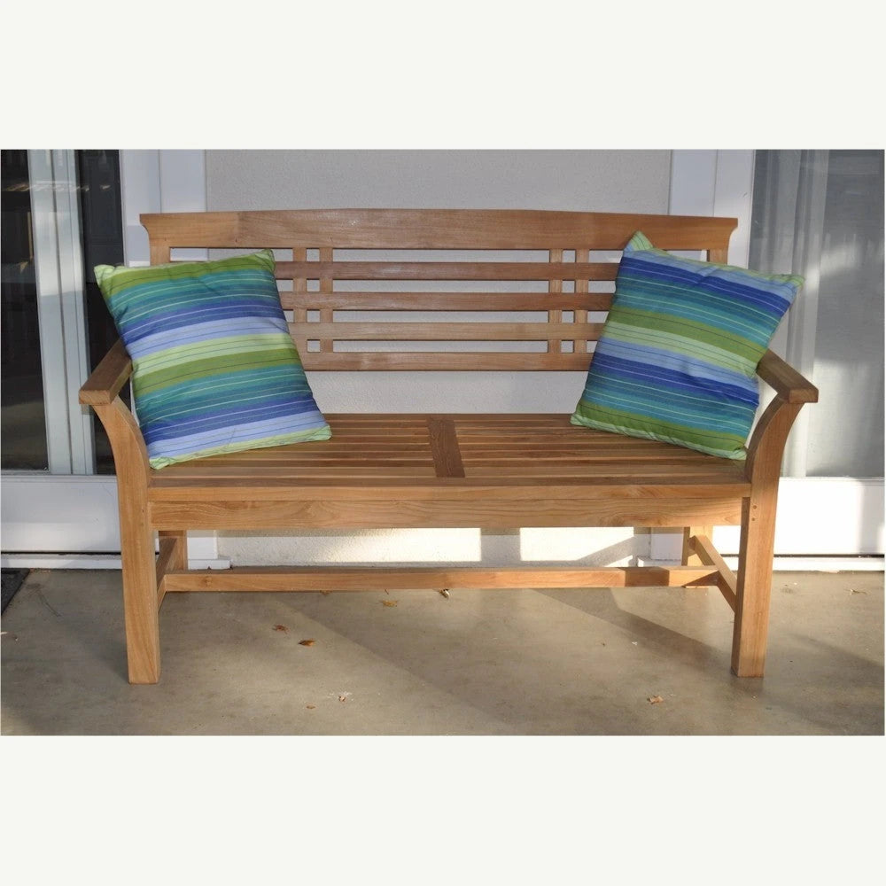 Wooden bench with striped cushions on a patio