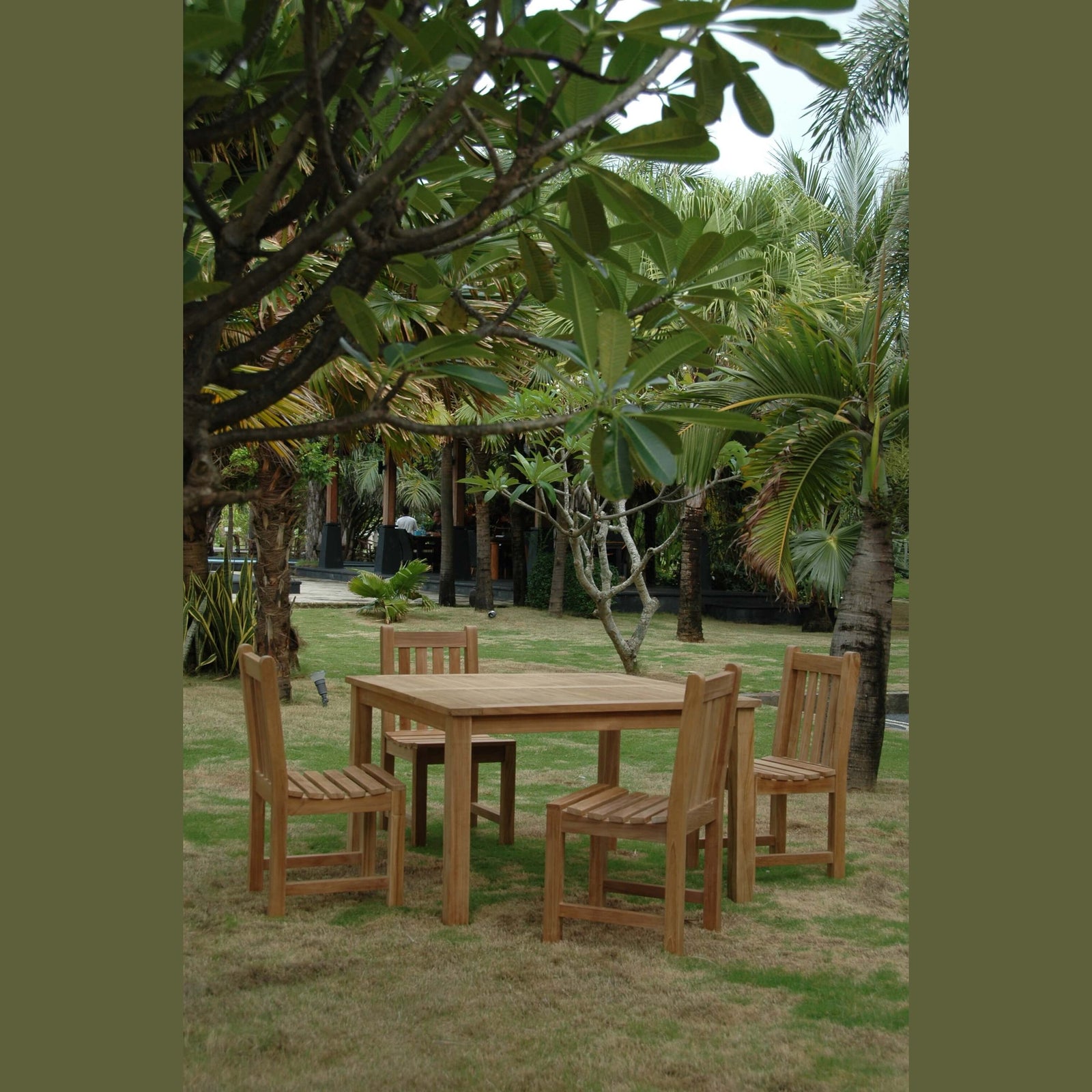 Wooden outdoor dining set with table and chairs in a garden setting