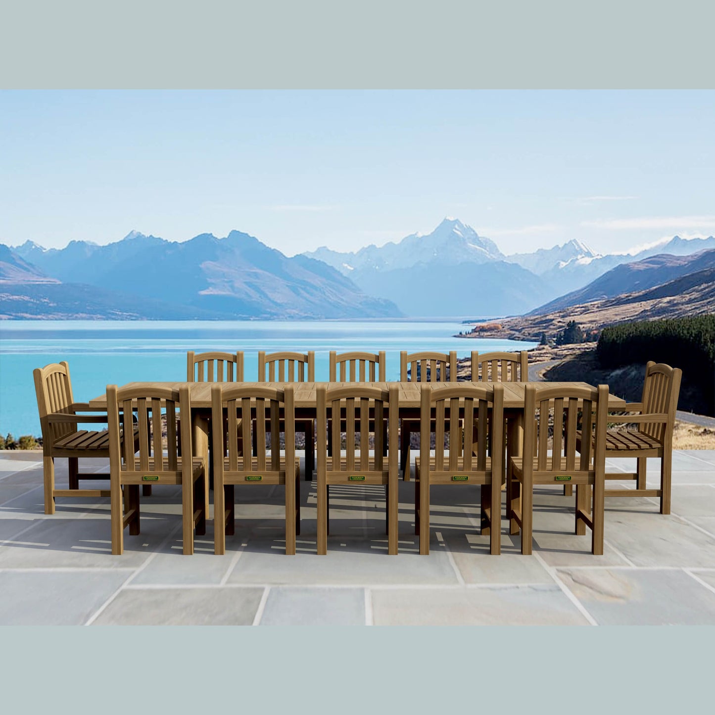 Wooden outdoor dining set with chairs and table in front of a scenic mountain and lake view.