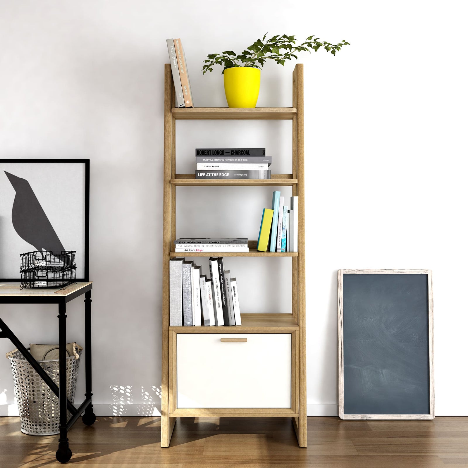 Wooden bookshelf with books and a plant in a yellow pot against a white wall.