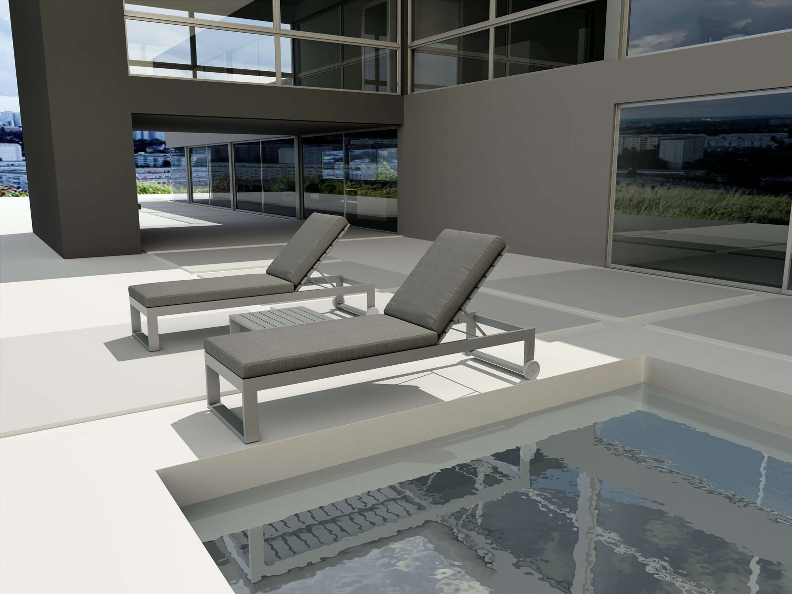 Two gray lounge chairs by a poolside with a modern building in the background