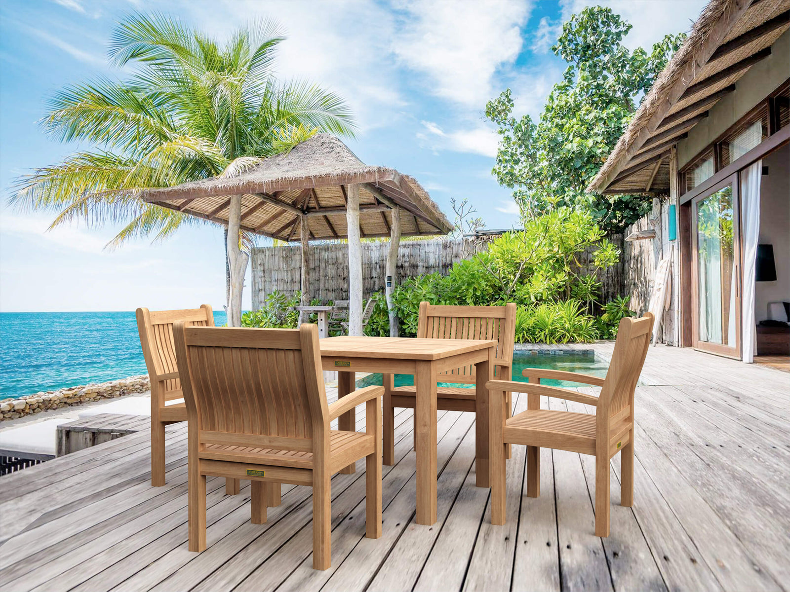 Wooden outdoor furniture set on a deck with ocean view