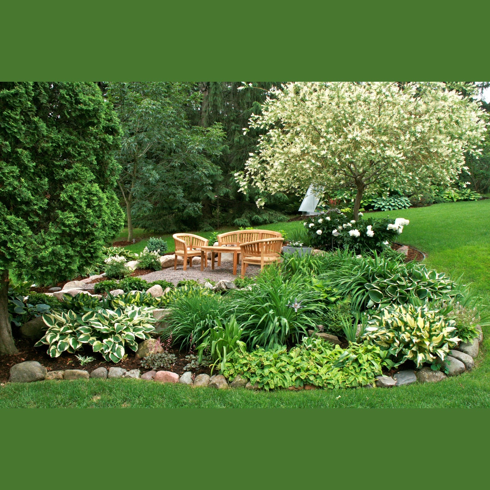 Garden with wooden furniture, plants, and trees in a natural setting
