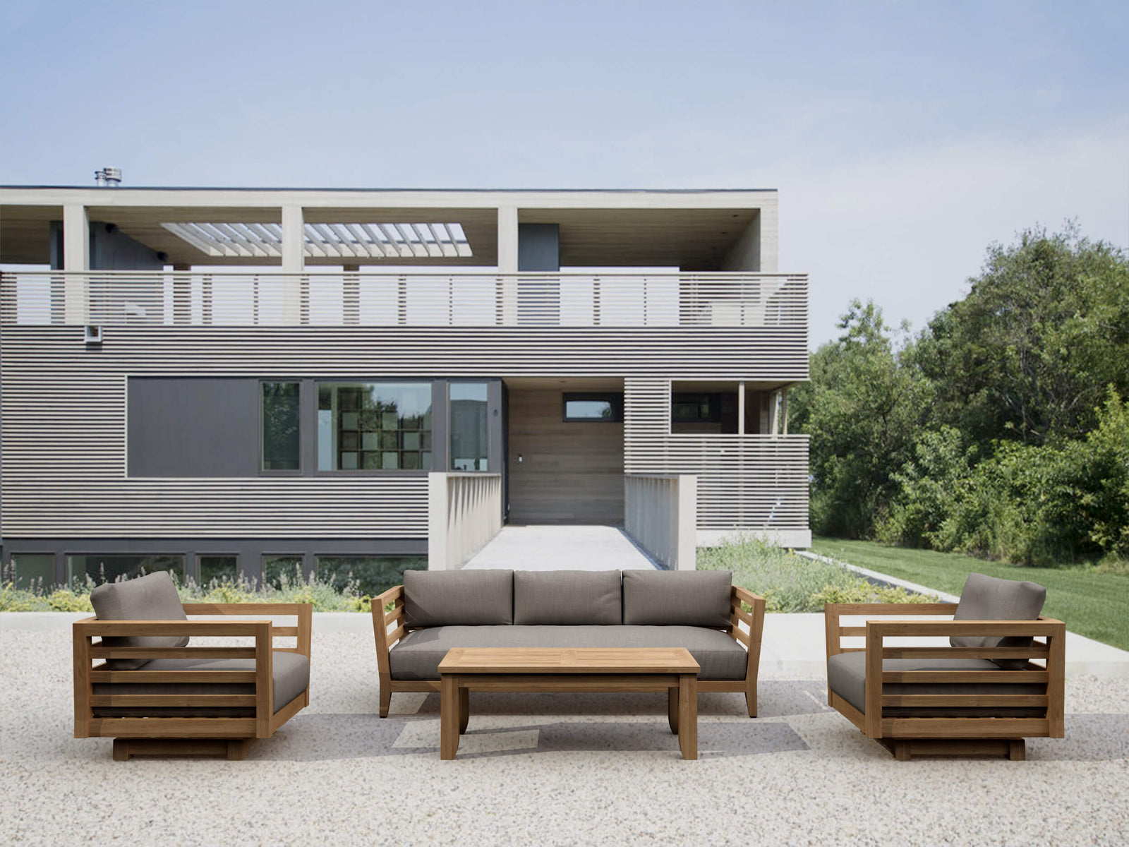 Modern outdoor furniture set in front of a contemporary house