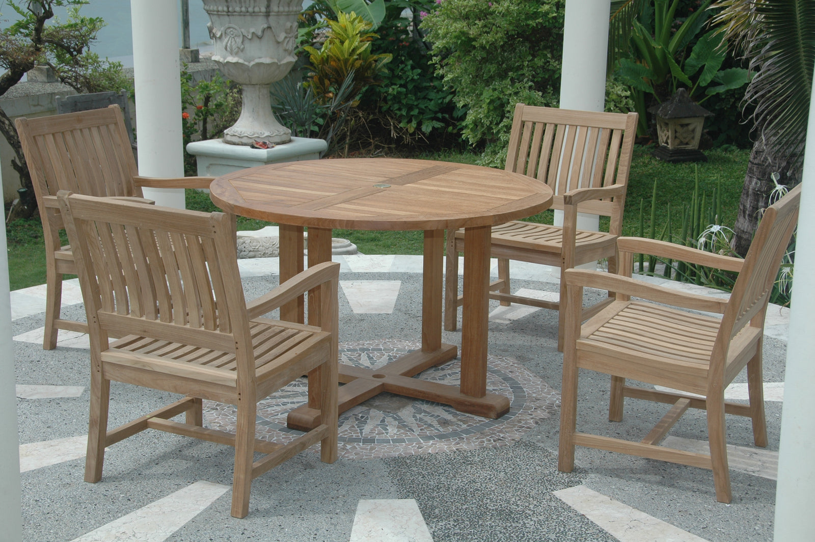 Wooden outdoor dining set with round table and chairs on a patio.