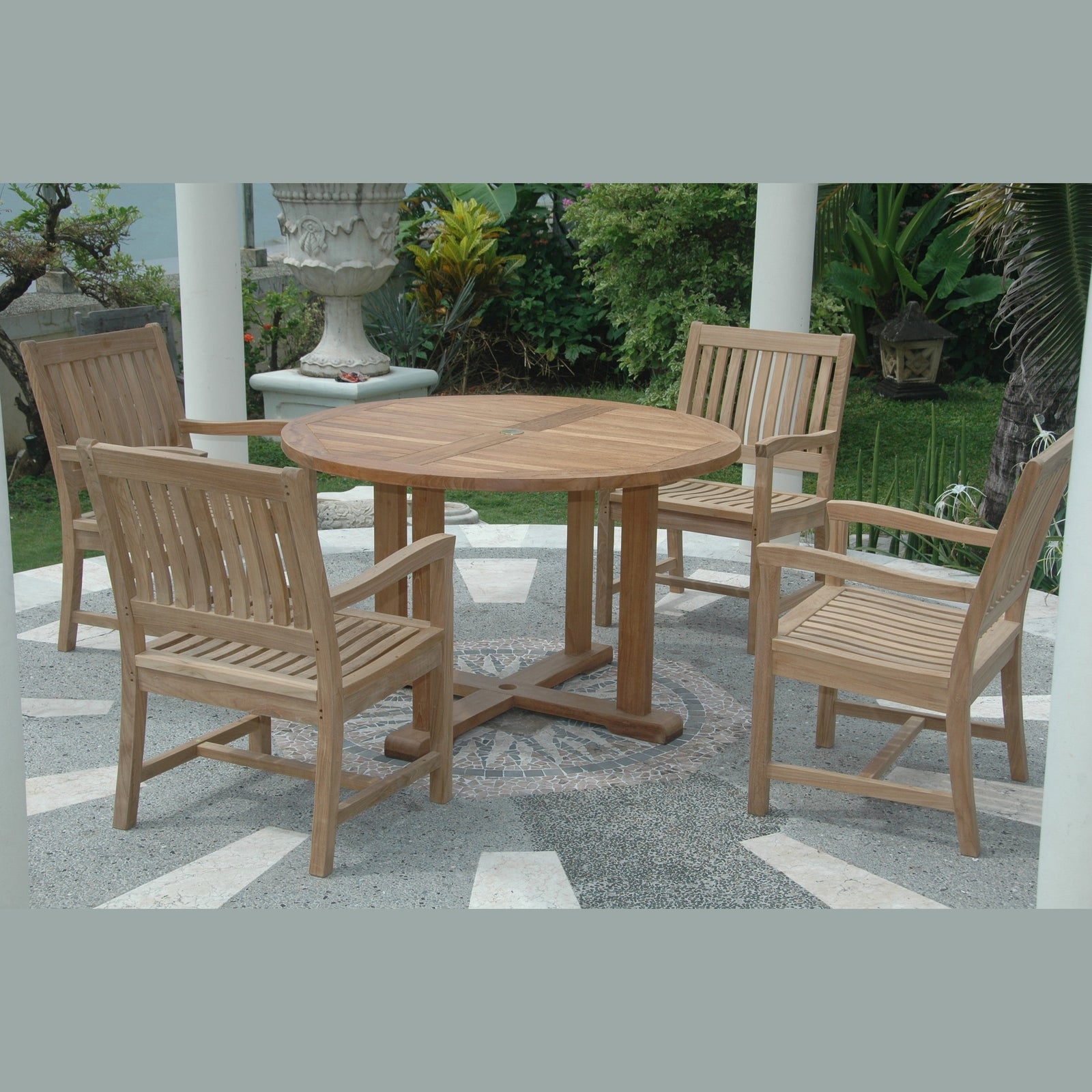 Wooden outdoor dining set with round table and chairs on a patio.