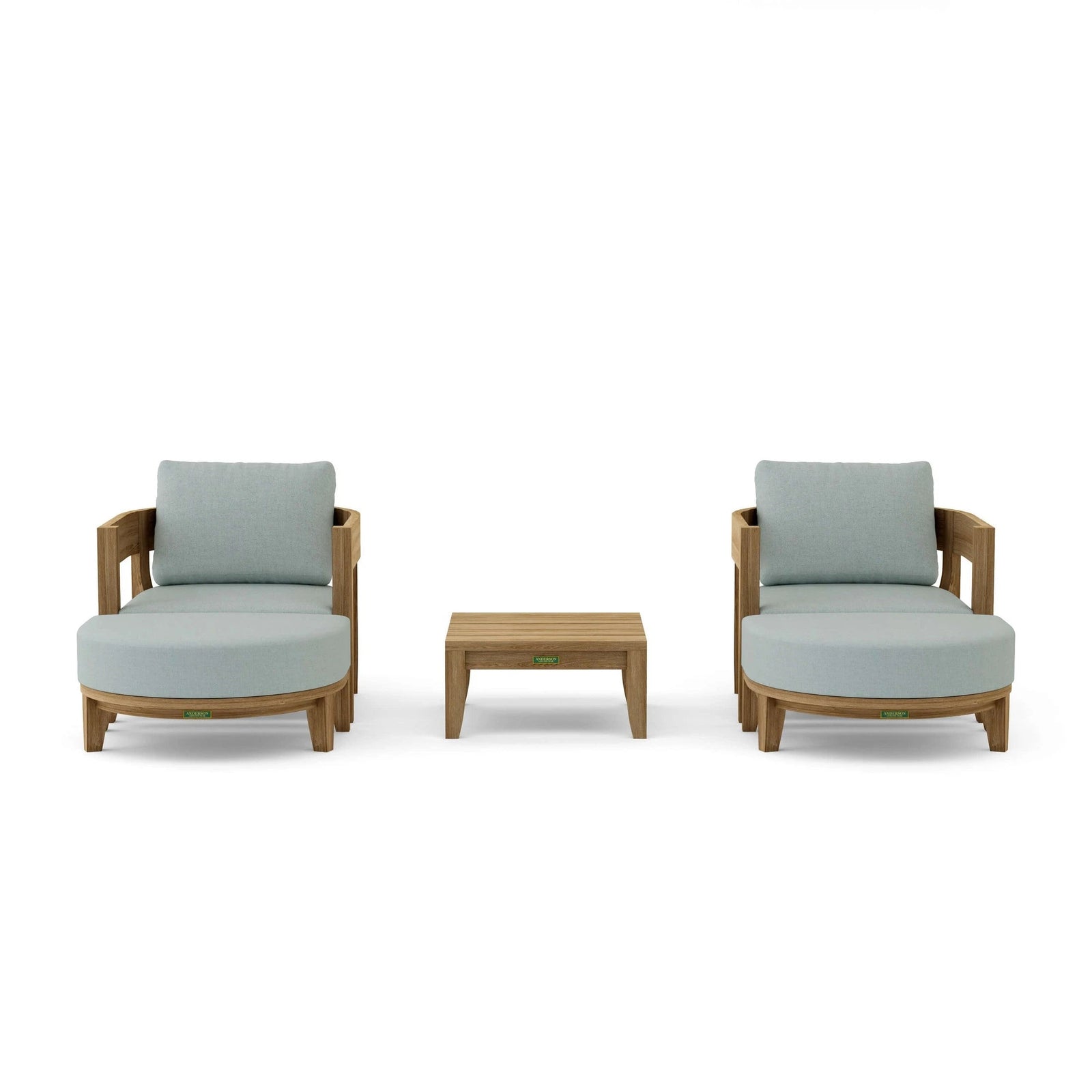 Two light gray cushioned chairs with a small wooden table on a white background