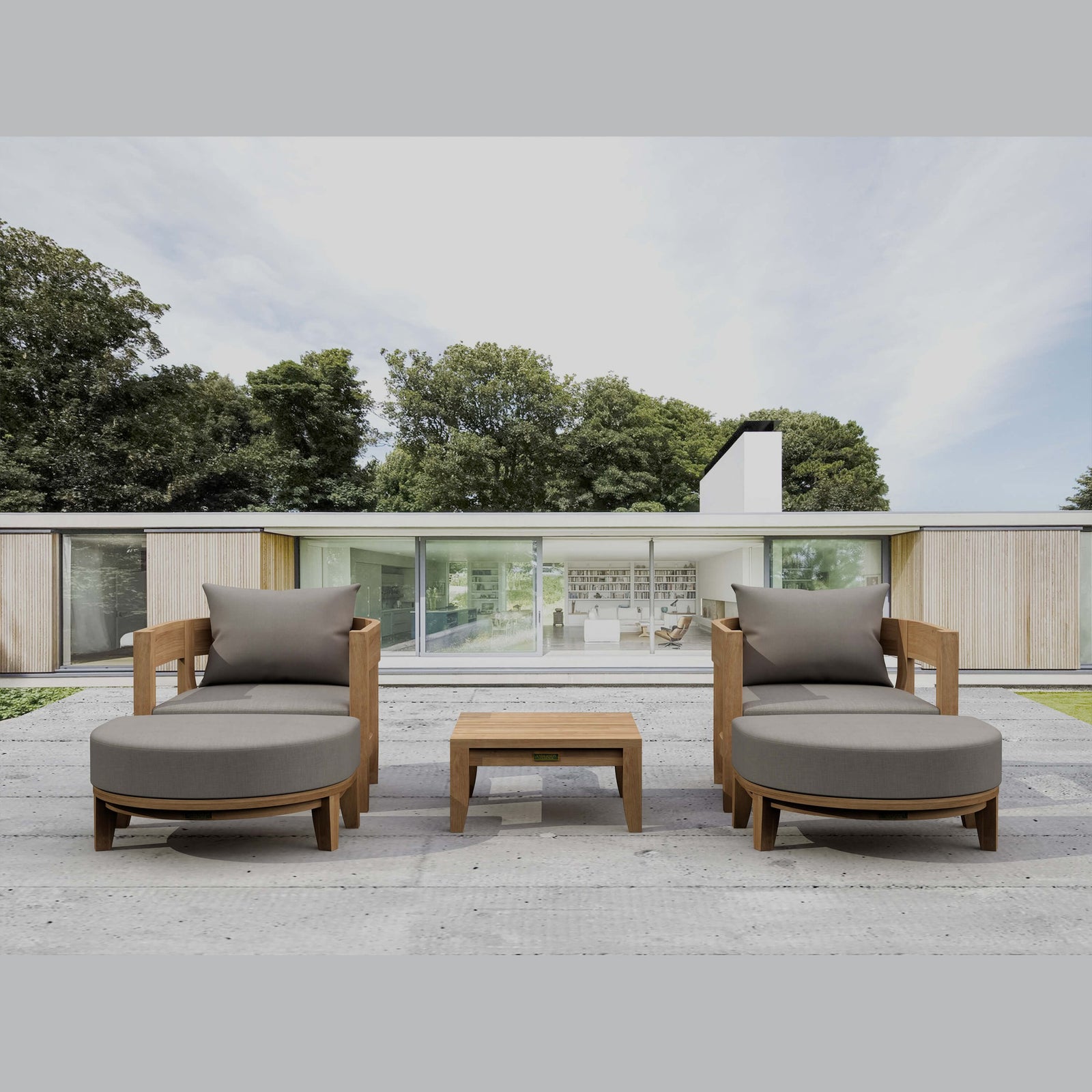 Outdoor patio furniture set with gray cushions on a wooden deck.
