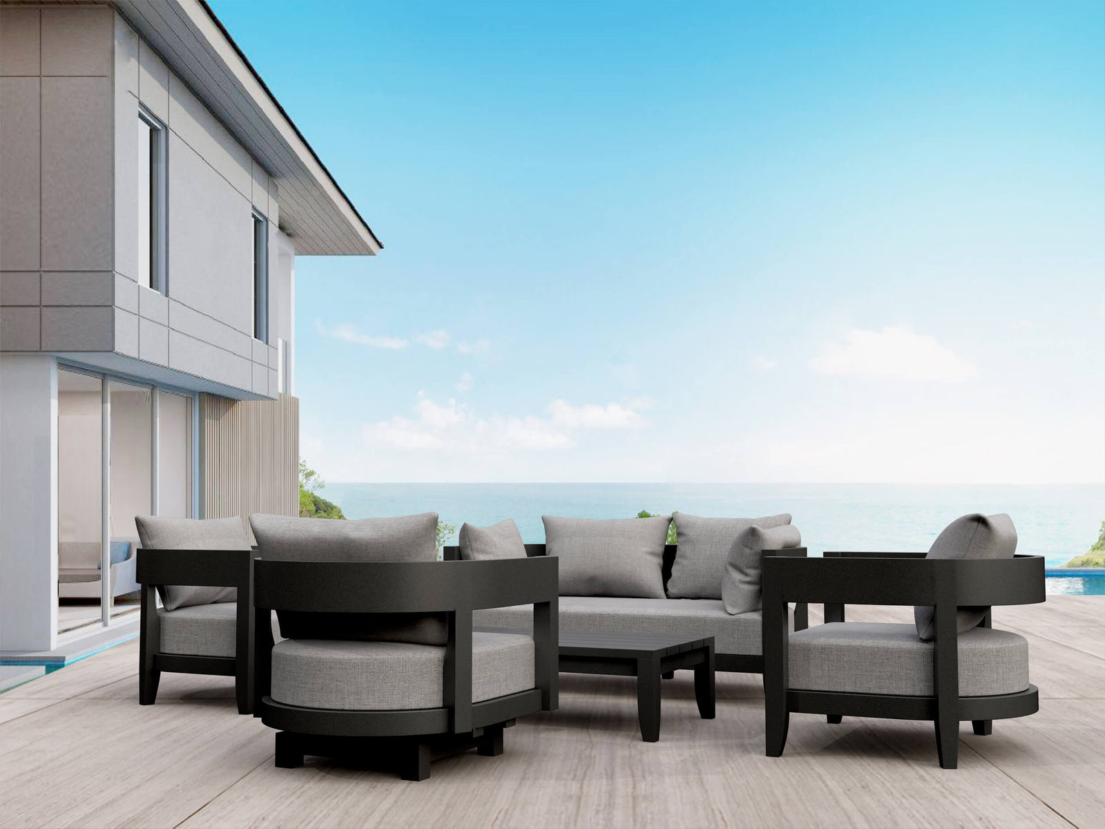 Outdoor patio furniture set with gray cushions on a wooden deck.