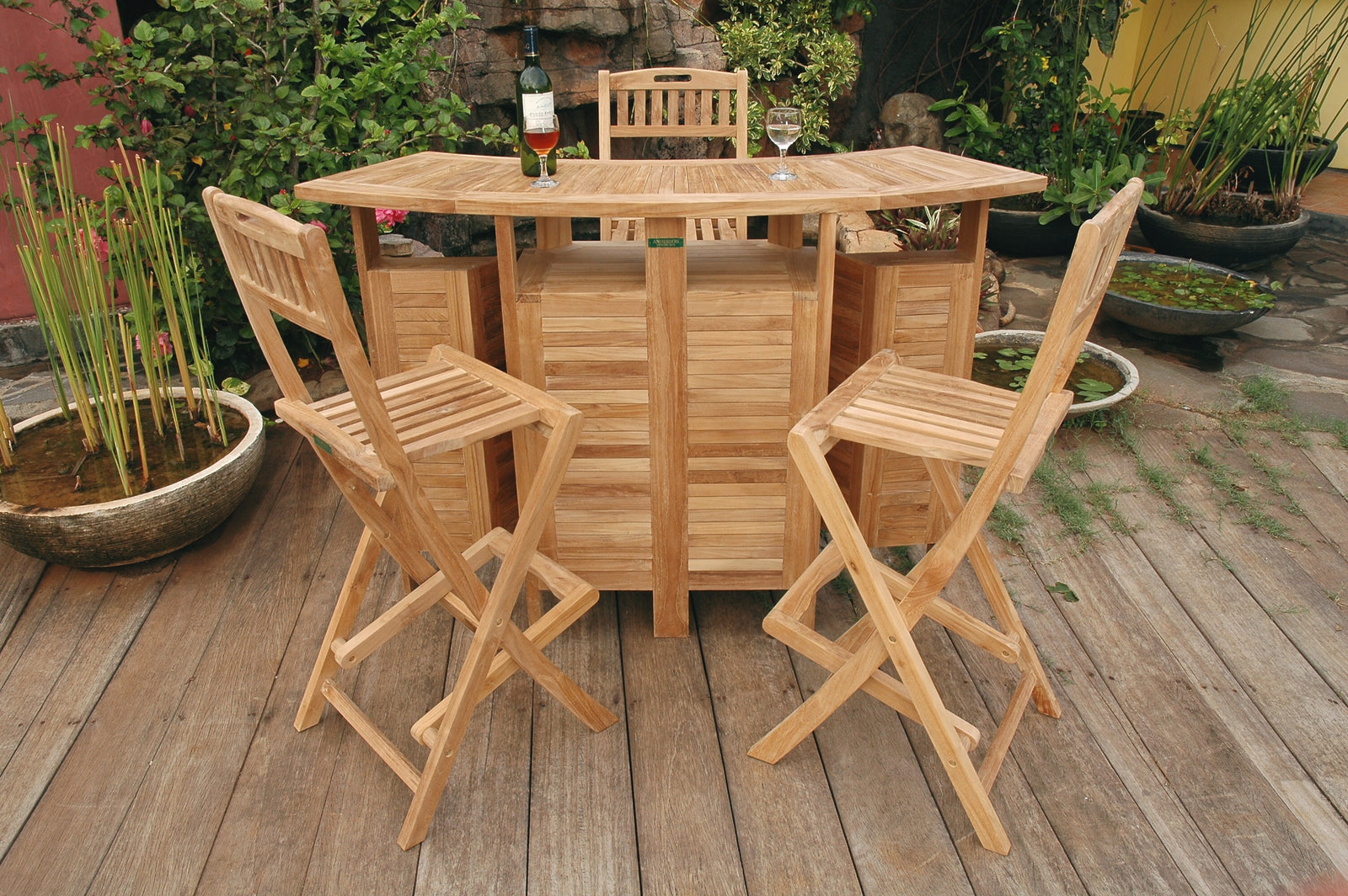 Wooden outdoor dining set with table and chairs on a wooden deck.