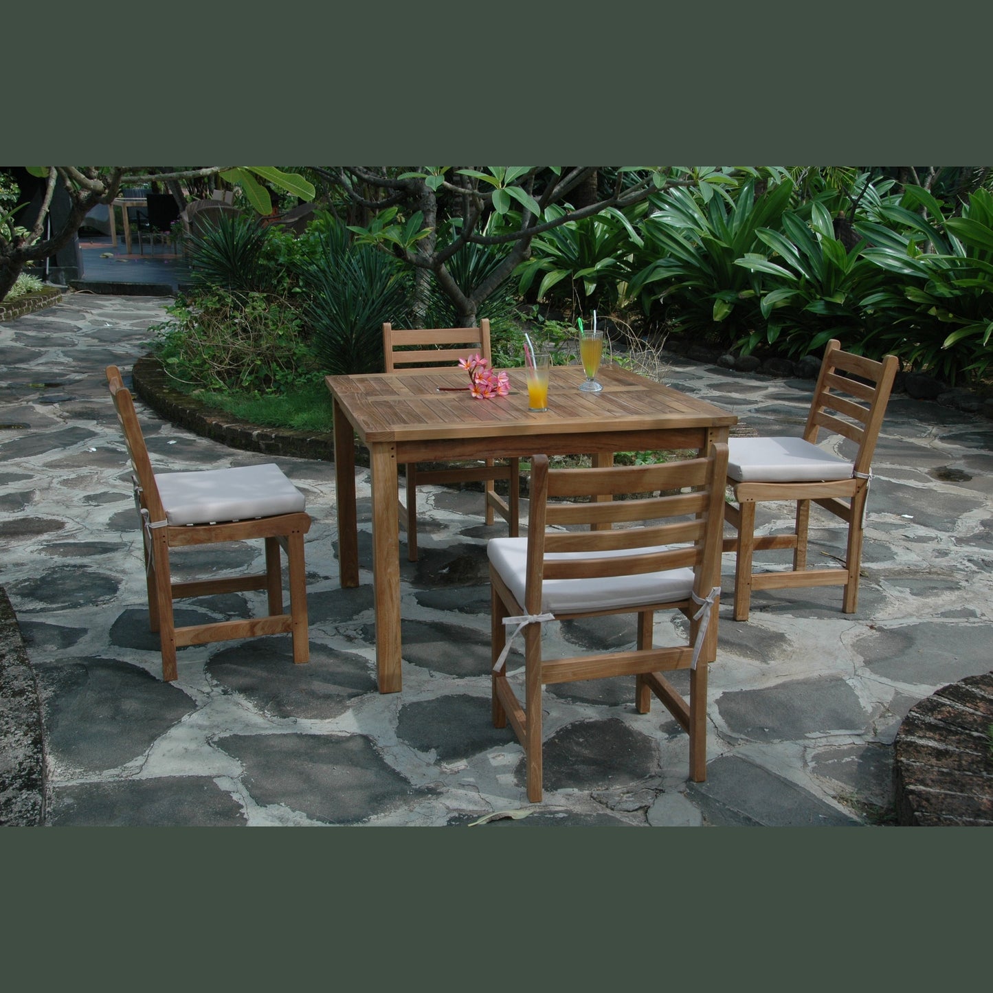 Wooden outdoor dining set with chairs and table on a stone patio