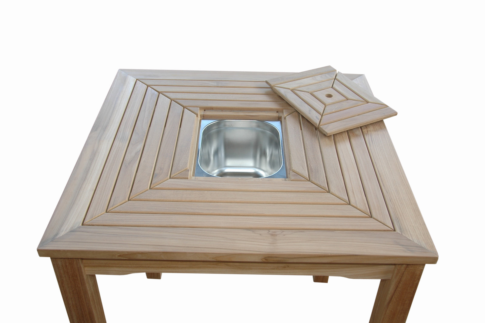Wooden table with a metal bowl in the center on a white background