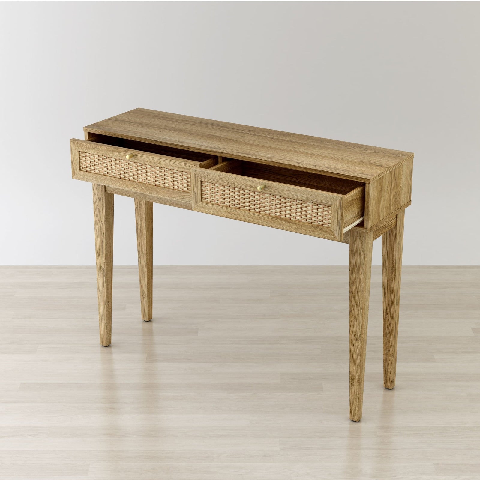 Wooden console table with two drawers on a light wooden floor.