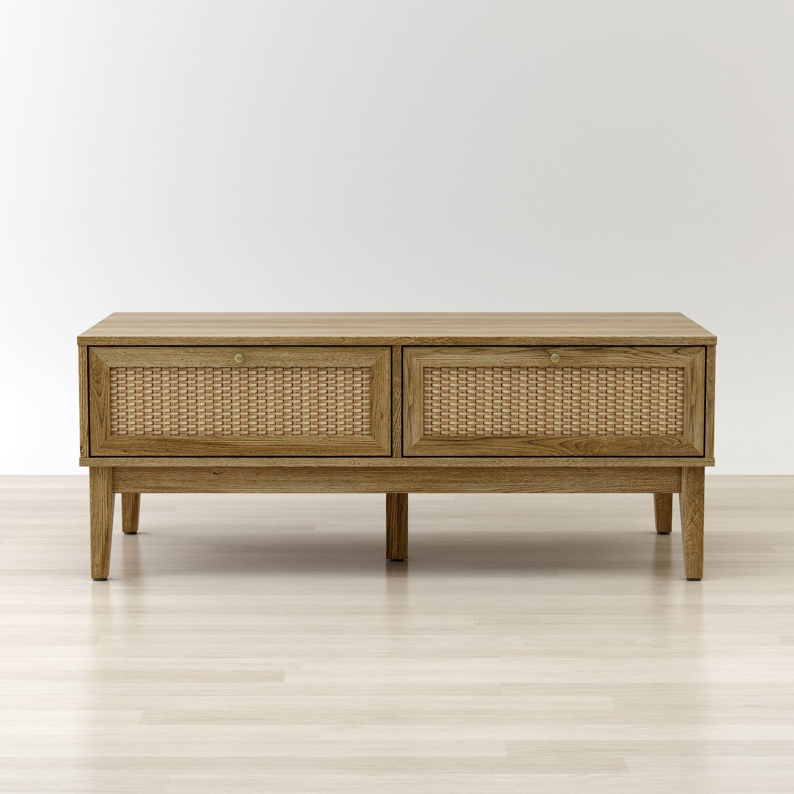Wooden console table with wicker doors on a light wooden floor and white background