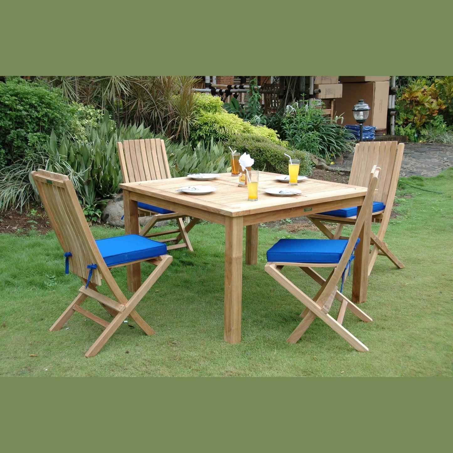 Wooden outdoor dining set with chairs and table on grass