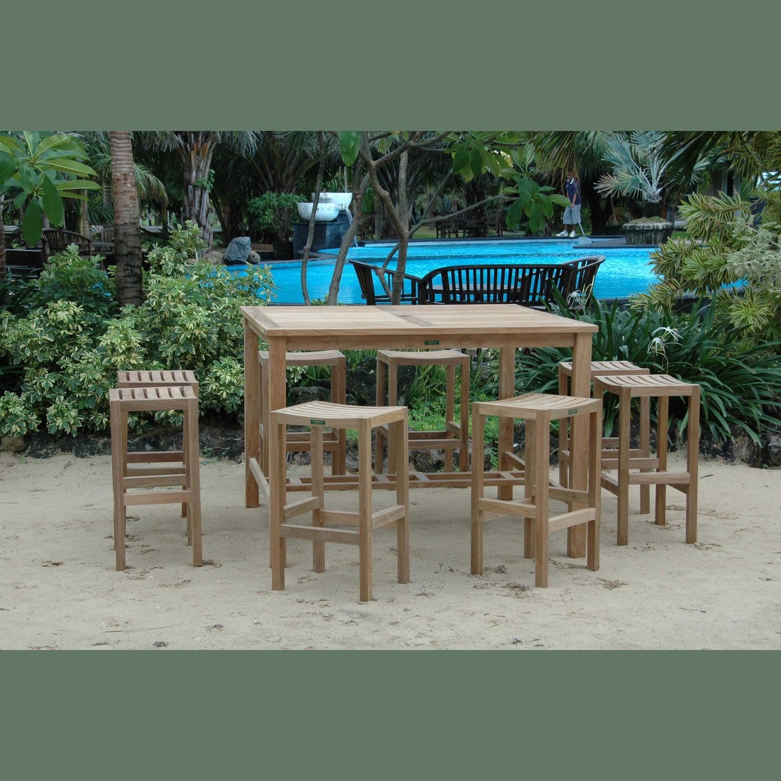 Wooden outdoor furniture set with table and stools near a pool