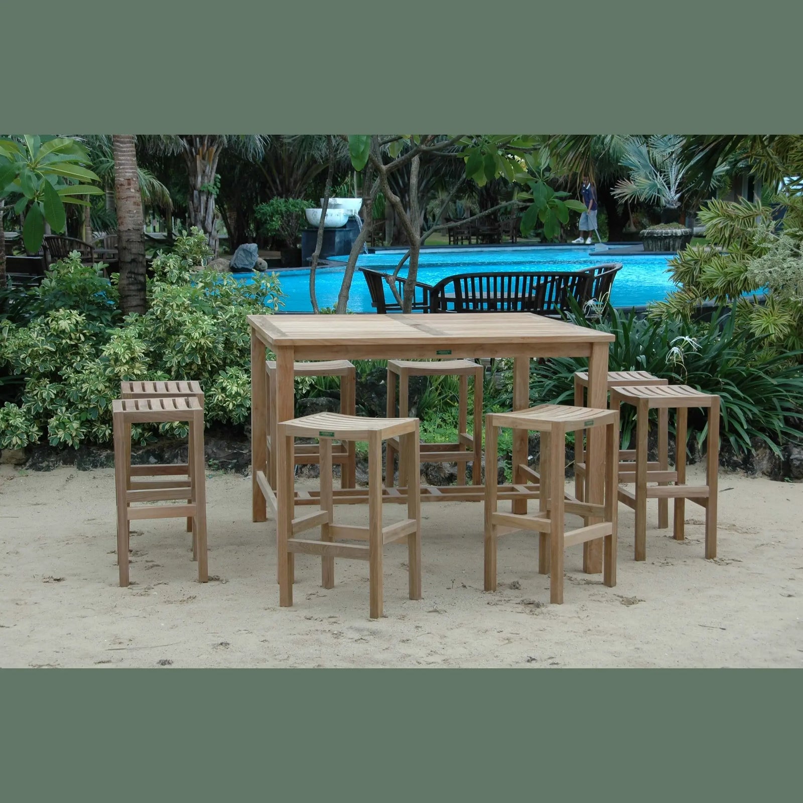 Wooden outdoor furniture set with table and stools near a pool
