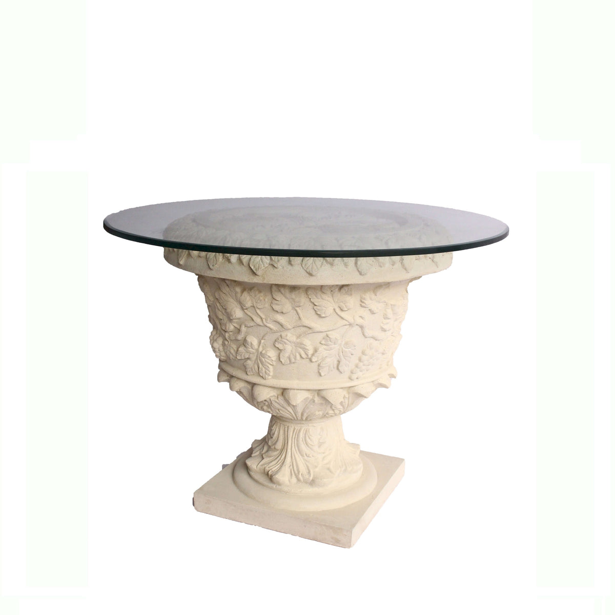 Decorative table with classical design and glass top on a white background