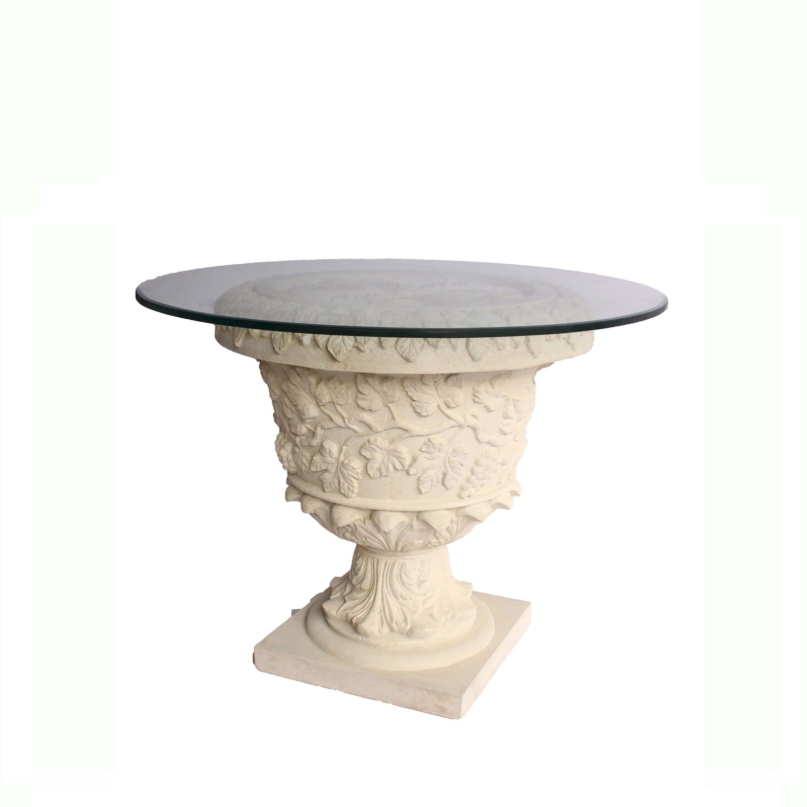 Decorative table with classical design and glass top on a white background