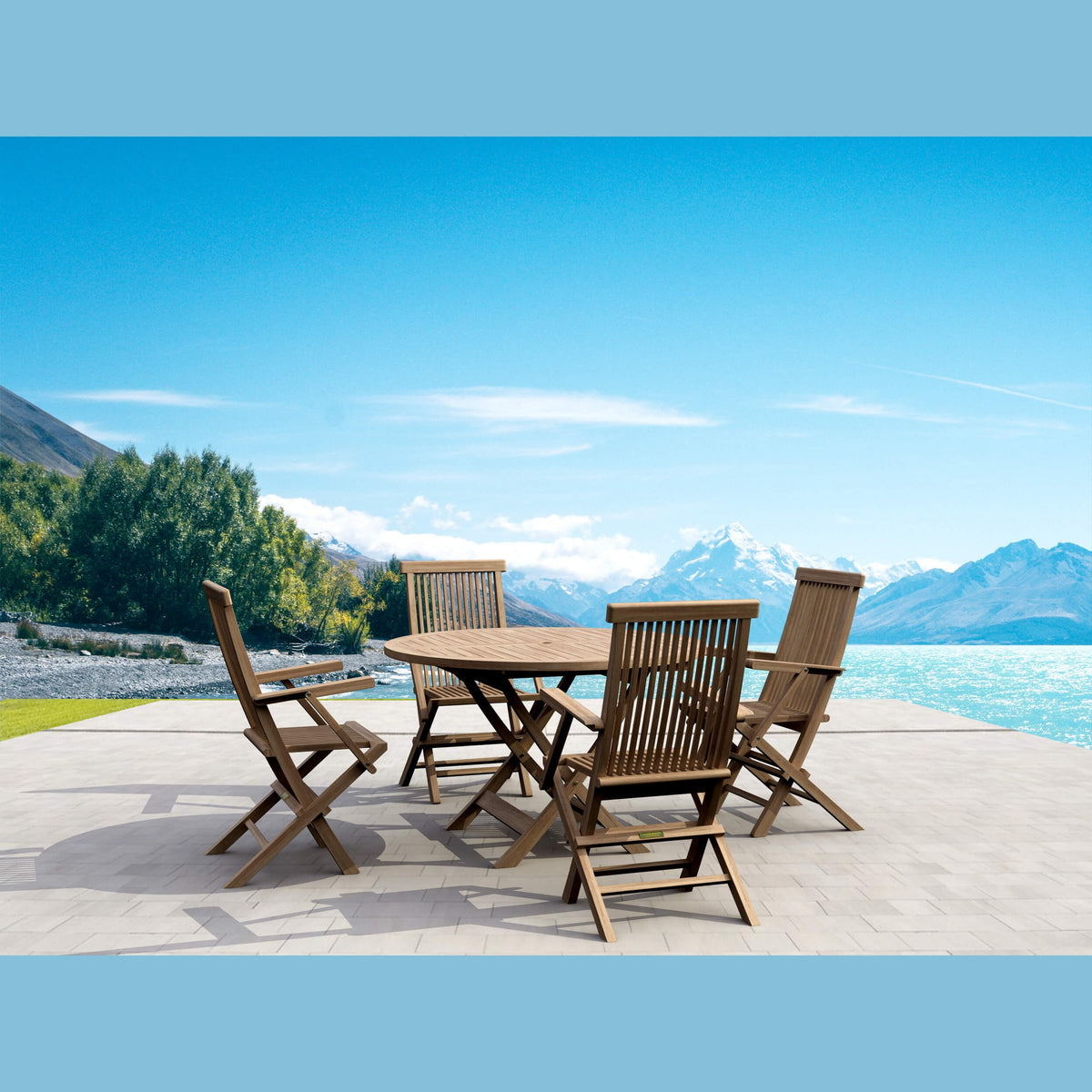 Wooden outdoor dining set with chairs on a patio overlooking mountains and water.