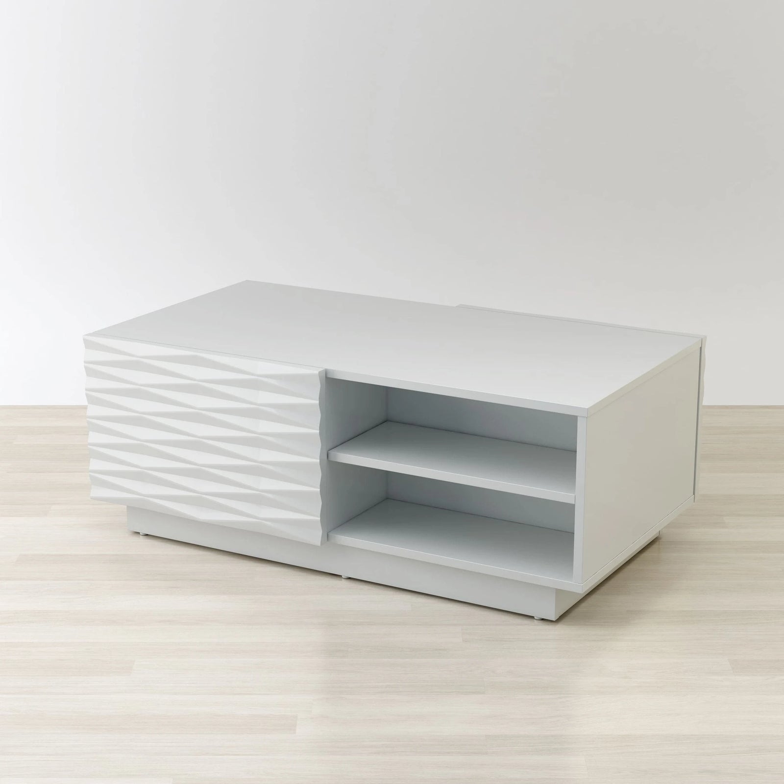 White textured side table with shelves on a light wooden floor and white background