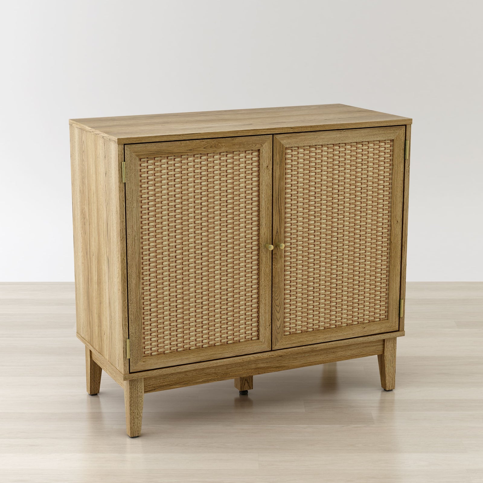 Wooden cabinet with wicker doors on a light wooden floor and white background
