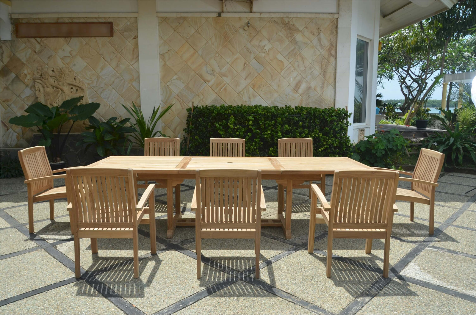 Outdoor wooden dining set with chairs on a patio
