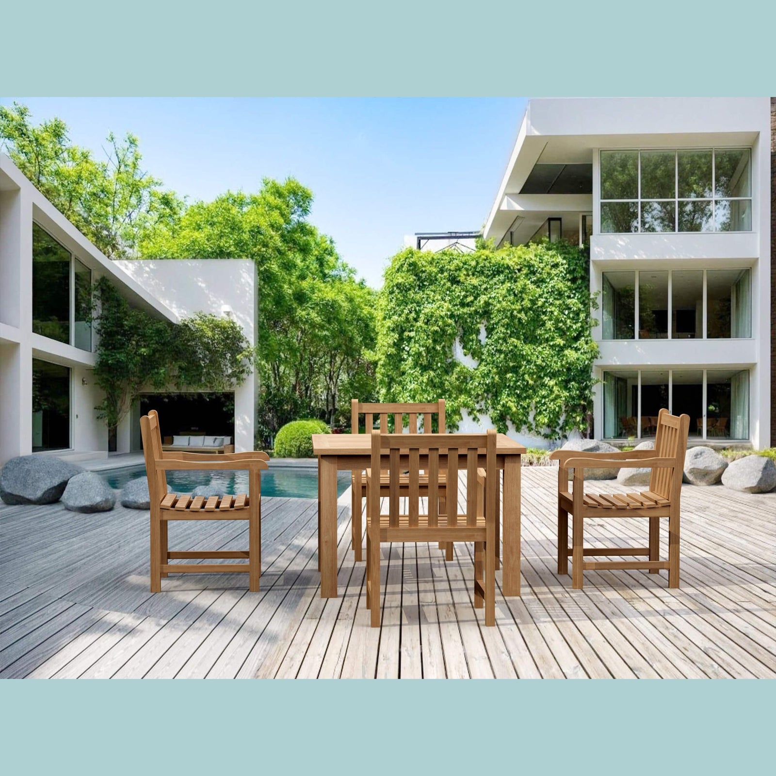 Wooden outdoor dining set on a deck with modern building and pool in the background