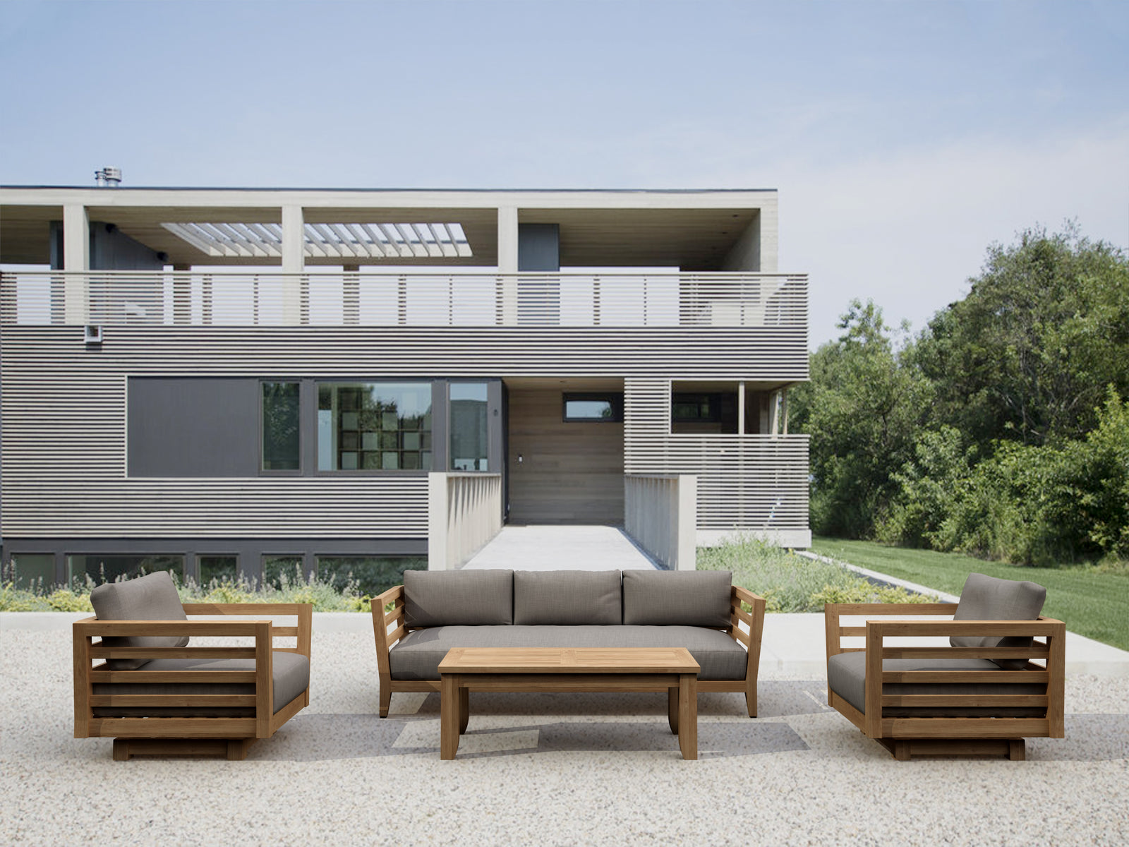 Modern outdoor furniture set in front of a contemporary house