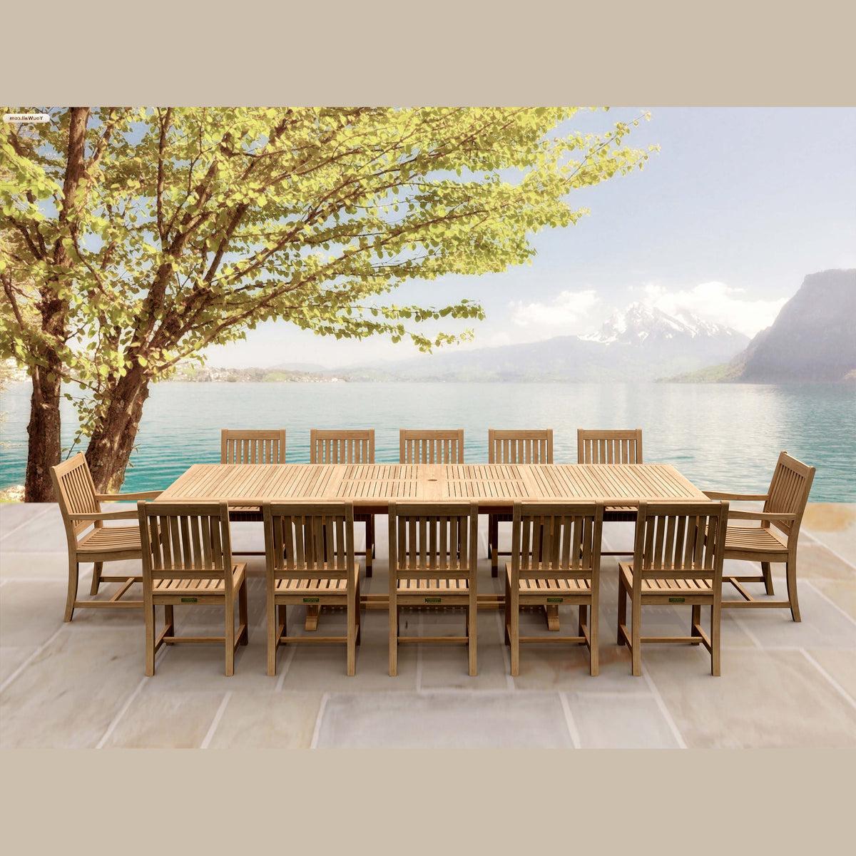 Wooden outdoor dining set with chairs by a lake and mountains