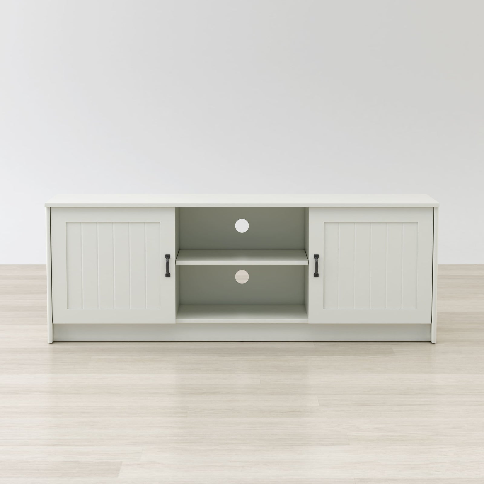 White entertainment console with open doors on a white background