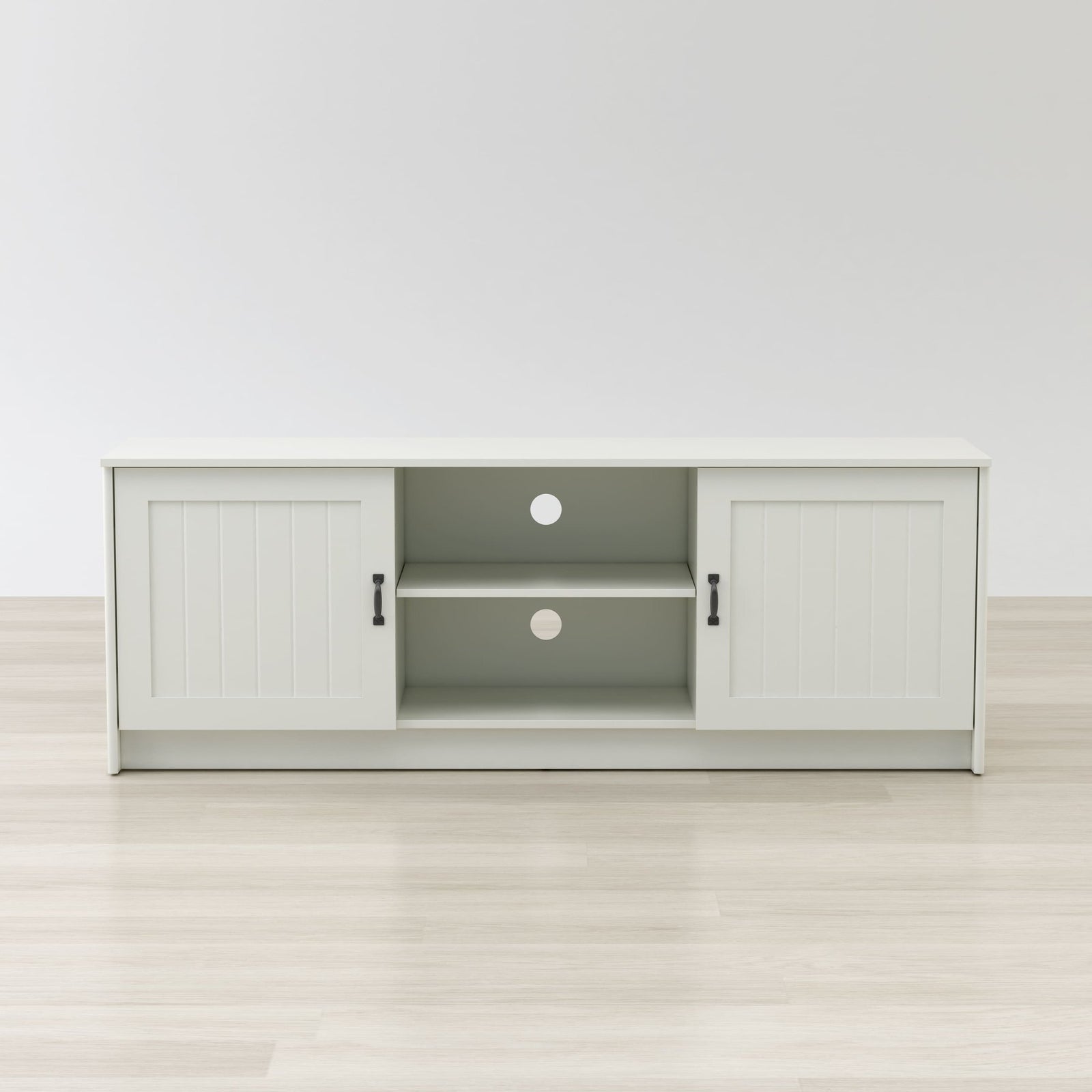White entertainment console with open doors on a white background