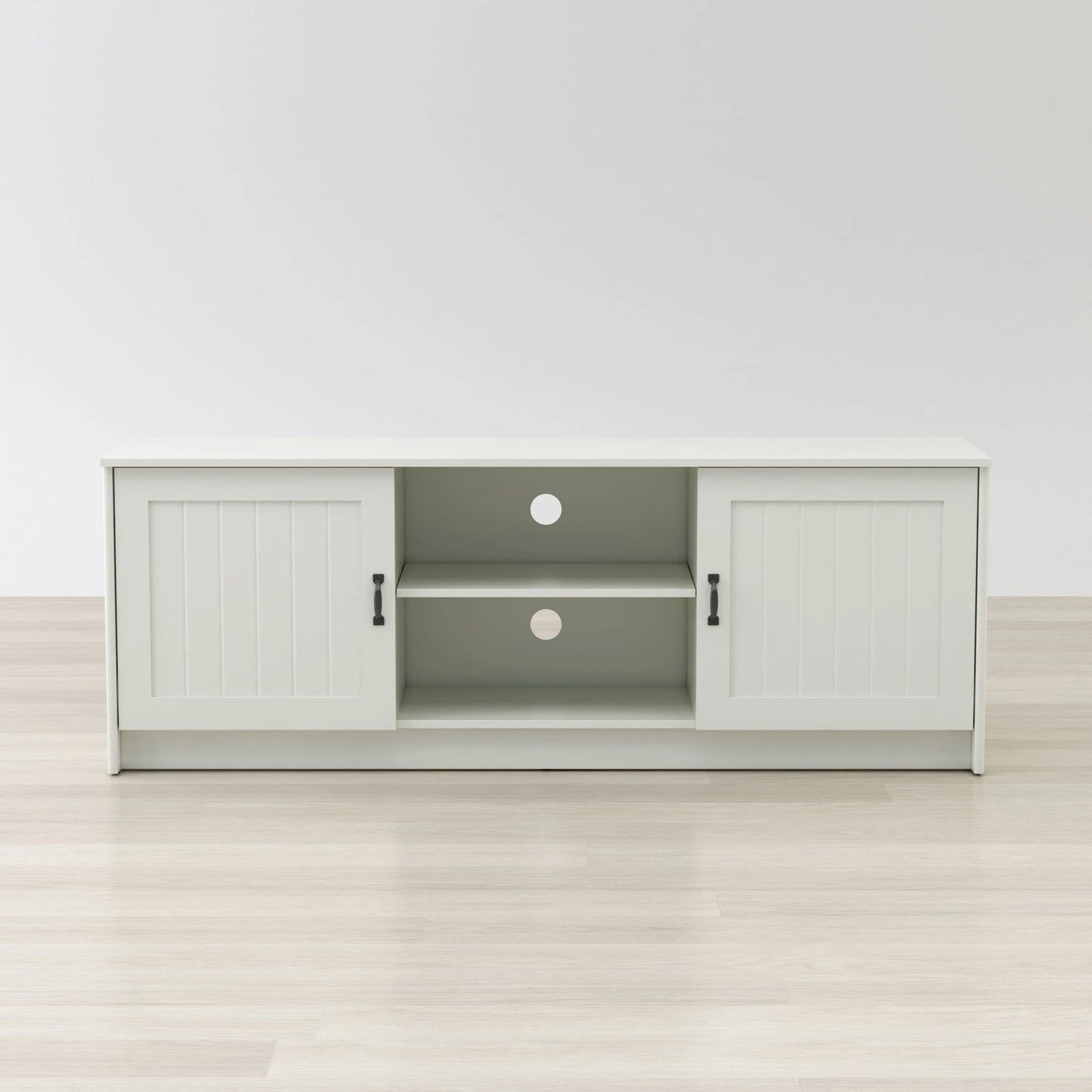 White entertainment console with open doors on a white background