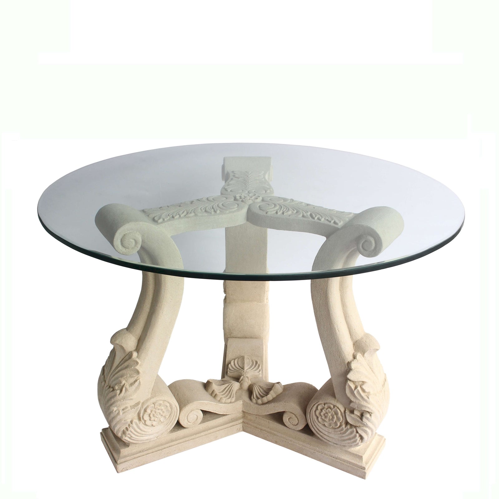 Decorative round table with glass top and ornate base on a white background