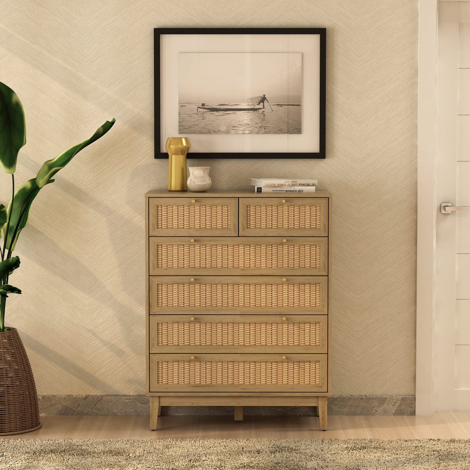 Wicker chest of drawers in a room with a framed picture on the wall.