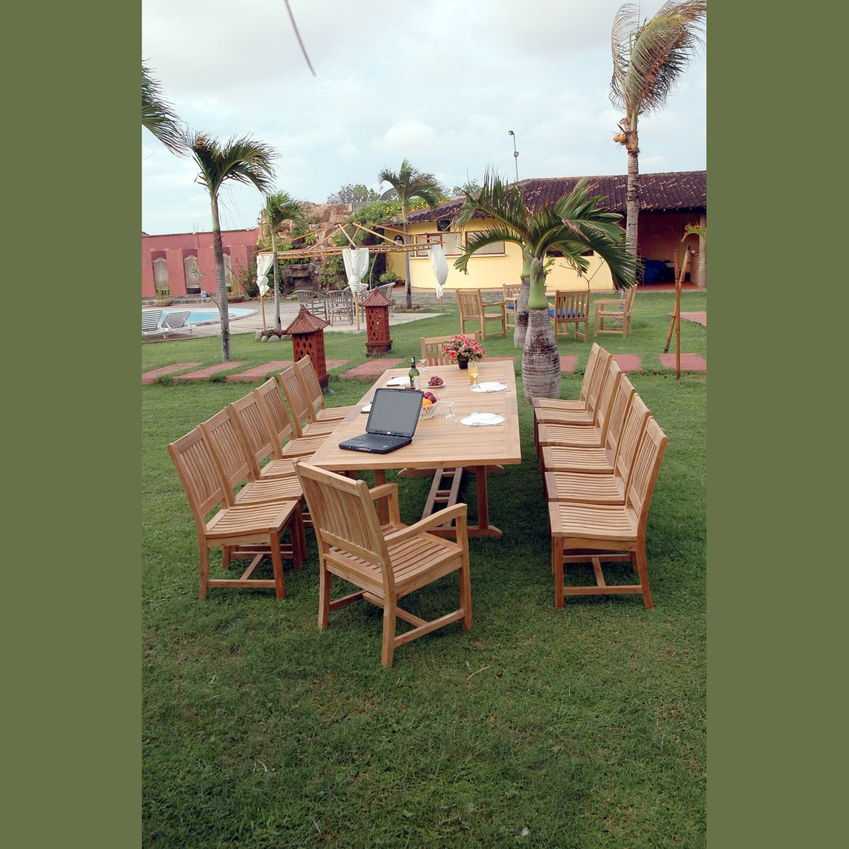 Outdoor wooden dining set with table and chairs on a grassy area
