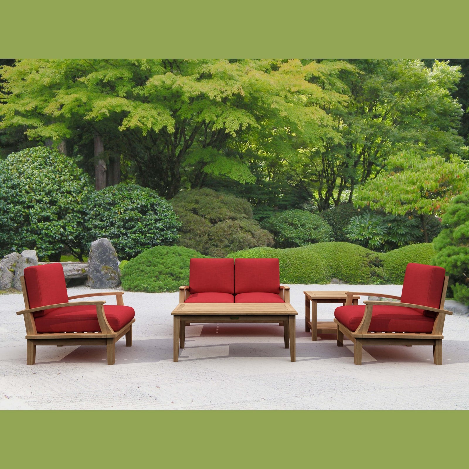 Outdoor furniture set with red cushions in a garden setting