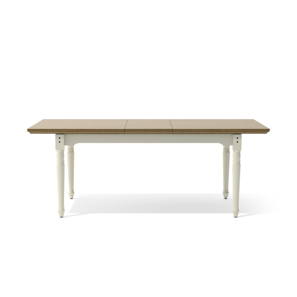 Wooden dining table with white legs on a white background