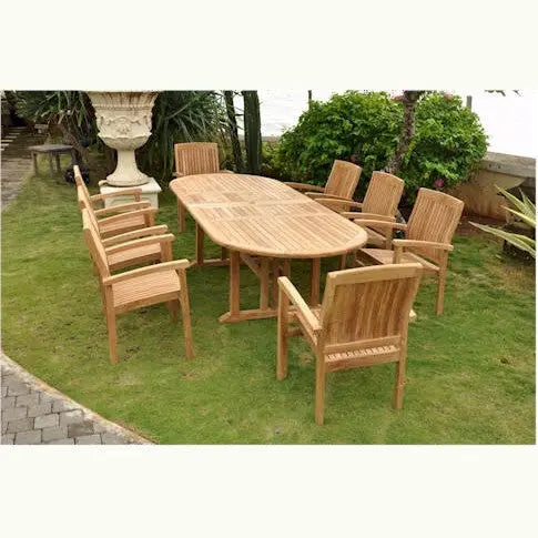 Wooden outdoor dining set with table and chairs on a grassy area