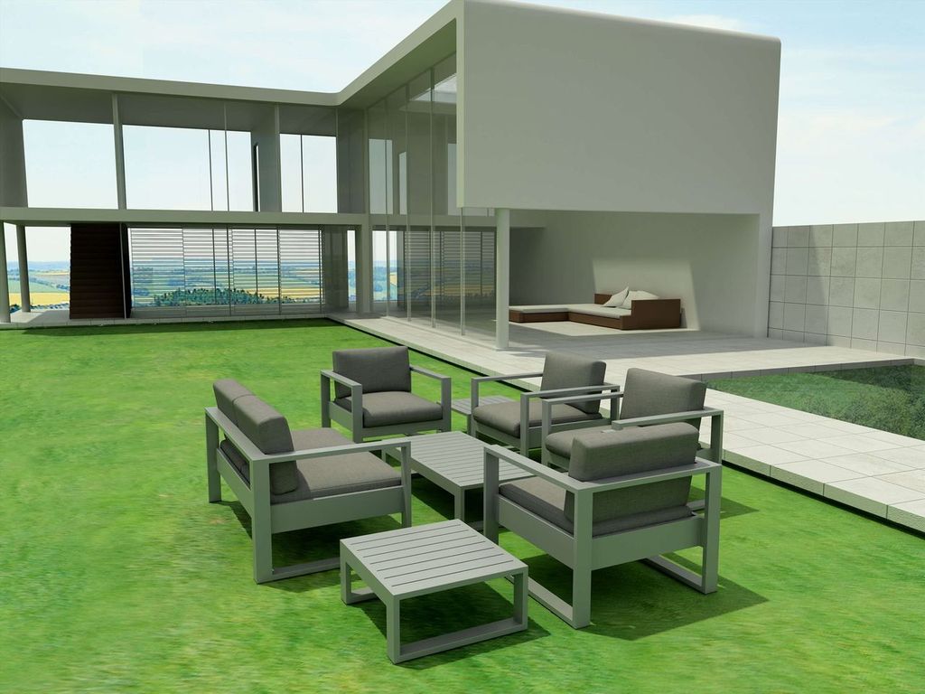 Modern outdoor furniture set on a green lawn with a house in the background