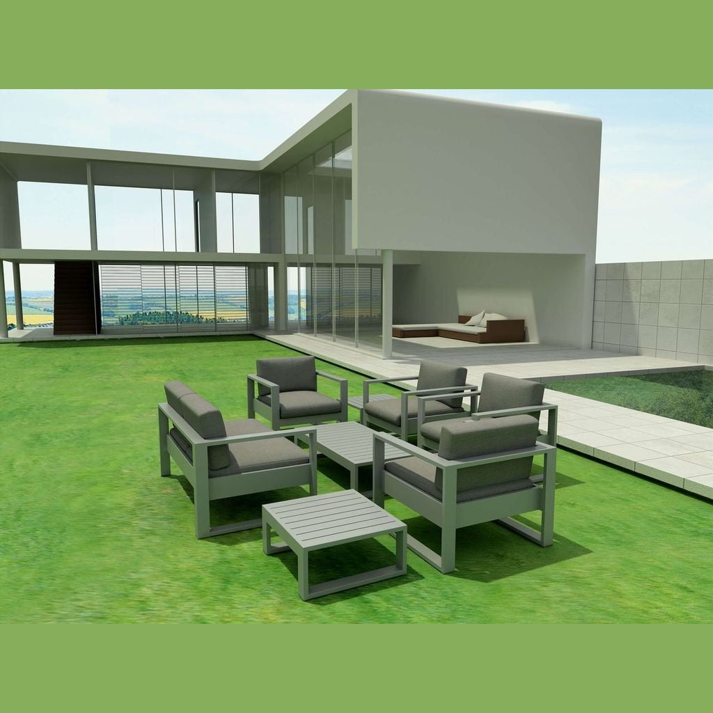 Modern outdoor furniture set on a green lawn with a house in the background