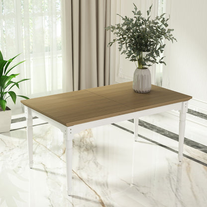 Wooden table with a white base in a bright room with plants and curtains.
