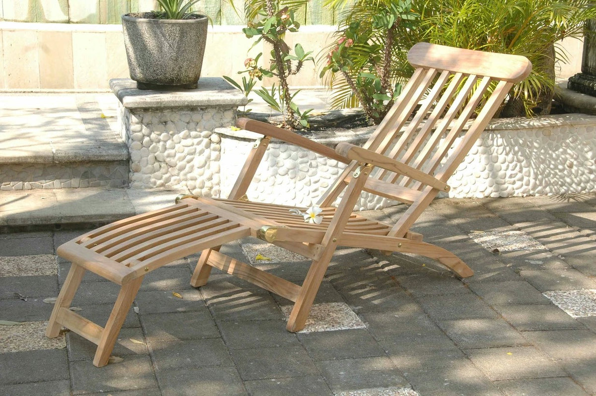 Wooden lounge chair with ottoman on a patio